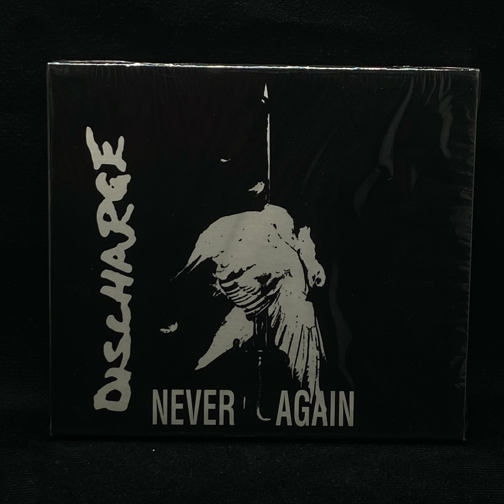 Discharge - Never Again CD Slipcase | Black Hearts Records